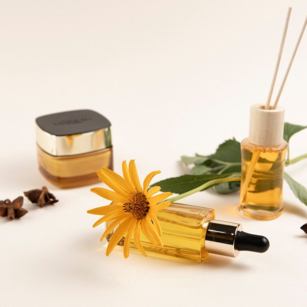 Golden face serum dropper bottle with sunflower and natural skincare ingredients